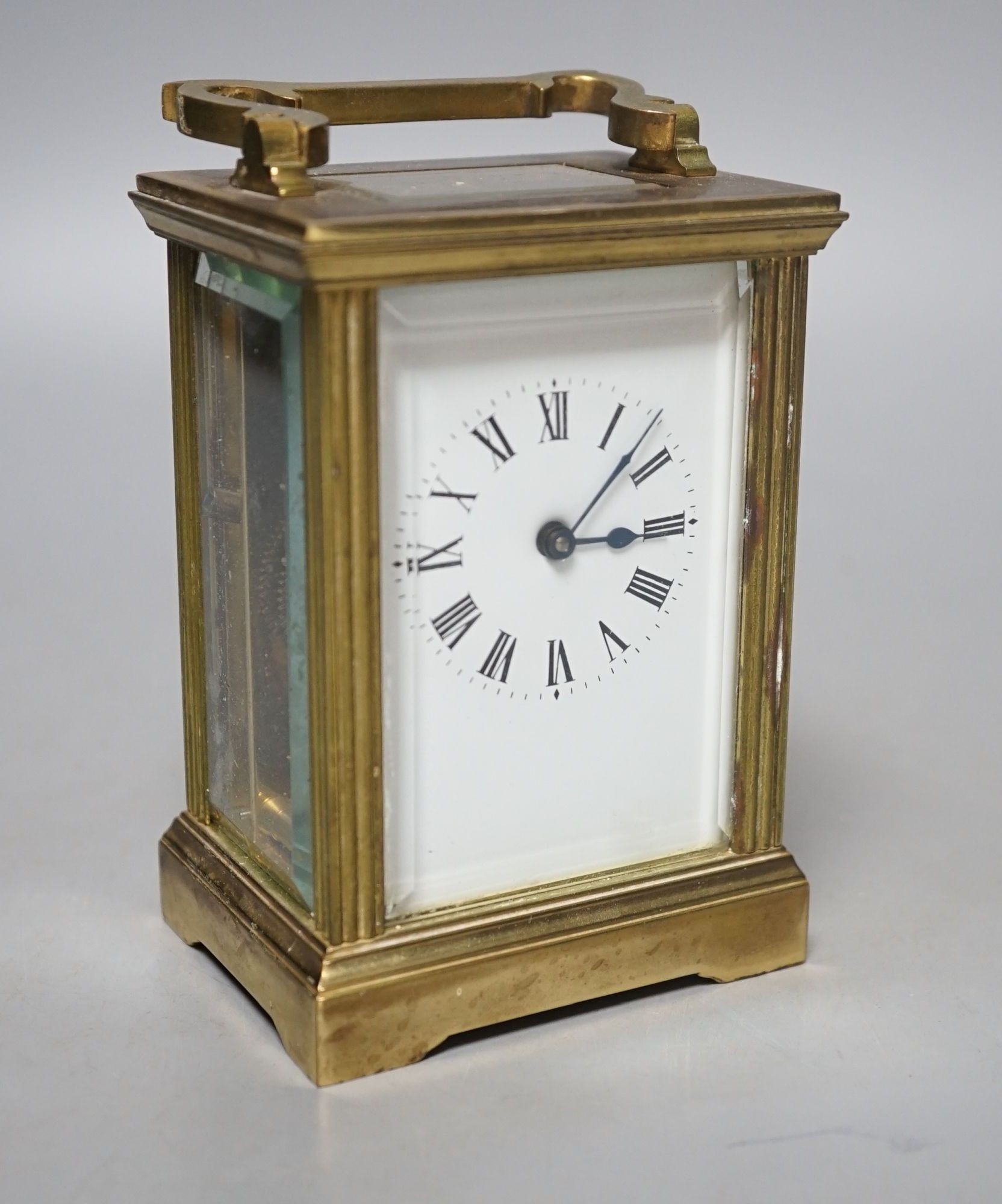 A French brass carriage timepiece, 11cms high.